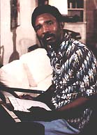 Clarence Reid by his piano (1976)